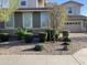 Two-story house with stone accents and landscaping at 14727 W Pasadena Ave, Litchfield Park, AZ 85340