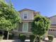 Two-story house with stone accents and landscaping at 14727 W Pasadena Ave, Litchfield Park, AZ 85340