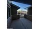 Covered front patio with stonework and wrought iron gate at 14727 W Pasadena Ave, Litchfield Park, AZ 85340