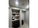 Hallway with built-in shelving and storage at 14727 W Pasadena Ave, Litchfield Park, AZ 85340