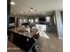 Large kitchen island with granite countertop and seating at 14727 W Pasadena Ave, Litchfield Park, AZ 85340