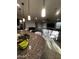 Open kitchen features a large island and breakfast bar, with views into the Gathering room at 14727 W Pasadena Ave, Litchfield Park, AZ 85340