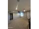 Spacious loft area with carpeted floor and ceiling fan at 14727 W Pasadena Ave, Litchfield Park, AZ 85340
