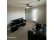 Home office with a large desk, comfortable couch, and plenty of light at 14727 W Pasadena Ave, Litchfield Park, AZ 85340