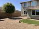 Landscaped yard with gravel and a small lawn at 14727 W Pasadena Ave, Litchfield Park, AZ 85340