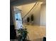 View of a curved staircase with an ornate railing and tile flooring at 14727 W Pasadena Ave, Litchfield Park, AZ 85340