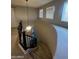 Upstairs hallway with a curved wall and a ceiling fan at 14727 W Pasadena Ave, Litchfield Park, AZ 85340