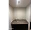 Wet bar with granite countertop and space for drinks at 14727 W Pasadena Ave, Litchfield Park, AZ 85340