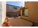 Paver patio and gravel area with a view to the covered patio and access to the home at 18409 W Dawn Dr, Surprise, AZ 85374