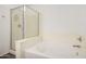 Bathroom featuring a tub and shower at 18409 W Dawn Dr, Surprise, AZ 85374