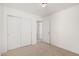 This bedroom has a closet and a neutral color scheme throughout at 18409 W Dawn Dr, Surprise, AZ 85374