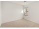 This bedroom has neutral carpeting and a window for natural light at 18409 W Dawn Dr, Surprise, AZ 85374