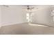 Spacious bright bedroom with ceiling fan and large windows at 18409 W Dawn Dr, Surprise, AZ 85374