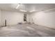 Spacious garage with concrete flooring and overhead lighting at 18409 W Dawn Dr, Surprise, AZ 85374