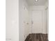 Bright hallway featuring a front door and wood floor at 18409 W Dawn Dr, Surprise, AZ 85374