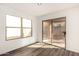 Bright room with new floor and a large window and glass door at 18409 W Dawn Dr, Surprise, AZ 85374