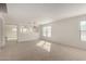 Bright living room with neutral carpet at 18409 W Dawn Dr, Surprise, AZ 85374
