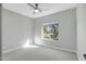 Bright bedroom with carpet flooring and a window offering natural light at 1873 W Dion Dr, Anthem, AZ 85086