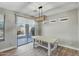 Dining area with a farmhouse table and sliding glass doors leading outside at 1873 W Dion Dr, Anthem, AZ 85086