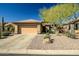 Single-story home with a two-car garage and well-maintained landscaping at 1873 W Dion Dr, Anthem, AZ 85086