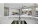 Kitchen island with a sink, providing extra prep space and seating at 1873 W Dion Dr, Anthem, AZ 85086
