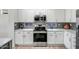 Modern kitchen with stainless steel appliances and gray backsplash at 1873 W Dion Dr, Anthem, AZ 85086