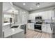Modern kitchen featuring white cabinets, stainless steel appliances, and quartz countertops at 1873 W Dion Dr, Anthem, AZ 85086