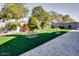 Landscaped backyard with artificial turf and brick pavers at 22432 W Kimberly Dr, Buckeye, AZ 85326