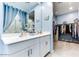 Bathroom with double vanity and walk-in closet at 22432 W Kimberly Dr, Buckeye, AZ 85326
