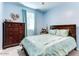Cozy bedroom with a dresser and a comfortable bed at 22432 W Kimberly Dr, Buckeye, AZ 85326