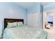 Well-lit bedroom with a double bed and closet at 22432 W Kimberly Dr, Buckeye, AZ 85326