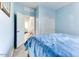 Comfortable bedroom with a double bed and access to another room at 22432 W Kimberly Dr, Buckeye, AZ 85326