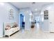 Light and airy entryway with a charming bench and decor at 22432 W Kimberly Dr, Buckeye, AZ 85326