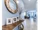 Elegant entryway showcasing a console table and mirror at 22432 W Kimberly Dr, Buckeye, AZ 85326