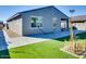 View of home's exterior showcasing backyard and landscaping at 22432 W Kimberly Dr, Buckeye, AZ 85326