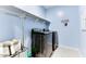 Laundry room with washer, dryer and overhead shelving at 22432 W Kimberly Dr, Buckeye, AZ 85326
