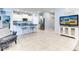 Open living area with kitchen and island, featuring tile flooring at 22432 W Kimberly Dr, Buckeye, AZ 85326