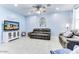 Bright living room with ample seating and a ceiling fan at 22432 W Kimberly Dr, Buckeye, AZ 85326