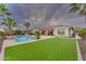Luxury home with a spacious backyard, pool, and lush landscaping at 32159 N 127Th Dr, Peoria, AZ 85383