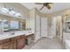 Elegant bathroom with double vanity, soaking tub, and walk-in shower at 32159 N 127Th Dr, Peoria, AZ 85383