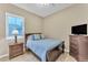 Charming bedroom with a comfortable bed and plenty of natural light at 32159 N 127Th Dr, Peoria, AZ 85383
