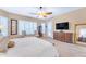 Bright bedroom with large windows, comfortable bed, and ample space at 32159 N 127Th Dr, Peoria, AZ 85383