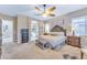 Spacious Primary bedroom with ensuite bathroom access and plenty of natural light at 32159 N 127Th Dr, Peoria, AZ 85383
