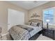 Cozy guest bedroom with ample closet space and window seating at 32159 N 127Th Dr, Peoria, AZ 85383