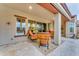 Relaxing patio space with comfortable seating near the pool and home at 32159 N 127Th Dr, Peoria, AZ 85383