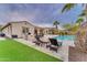 Relaxing pool and patio area with comfortable lounge chairs at 32159 N 127Th Dr, Peoria, AZ 85383