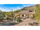 Single story home with terracotta roof and desert landscaping at 35035 N Whileaway Rd, Carefree, AZ 85377