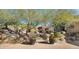 Landscaped backyard with desert plants and brick pathway at 35035 N Whileaway Rd, Carefree, AZ 85377