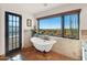 Relaxing bathroom with a clawfoot tub and mountain views at 35035 N Whileaway Rd, Carefree, AZ 85377
