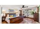 Soothing bedroom with leather bed frame and sitting area at 35035 N Whileaway Rd, Carefree, AZ 85377